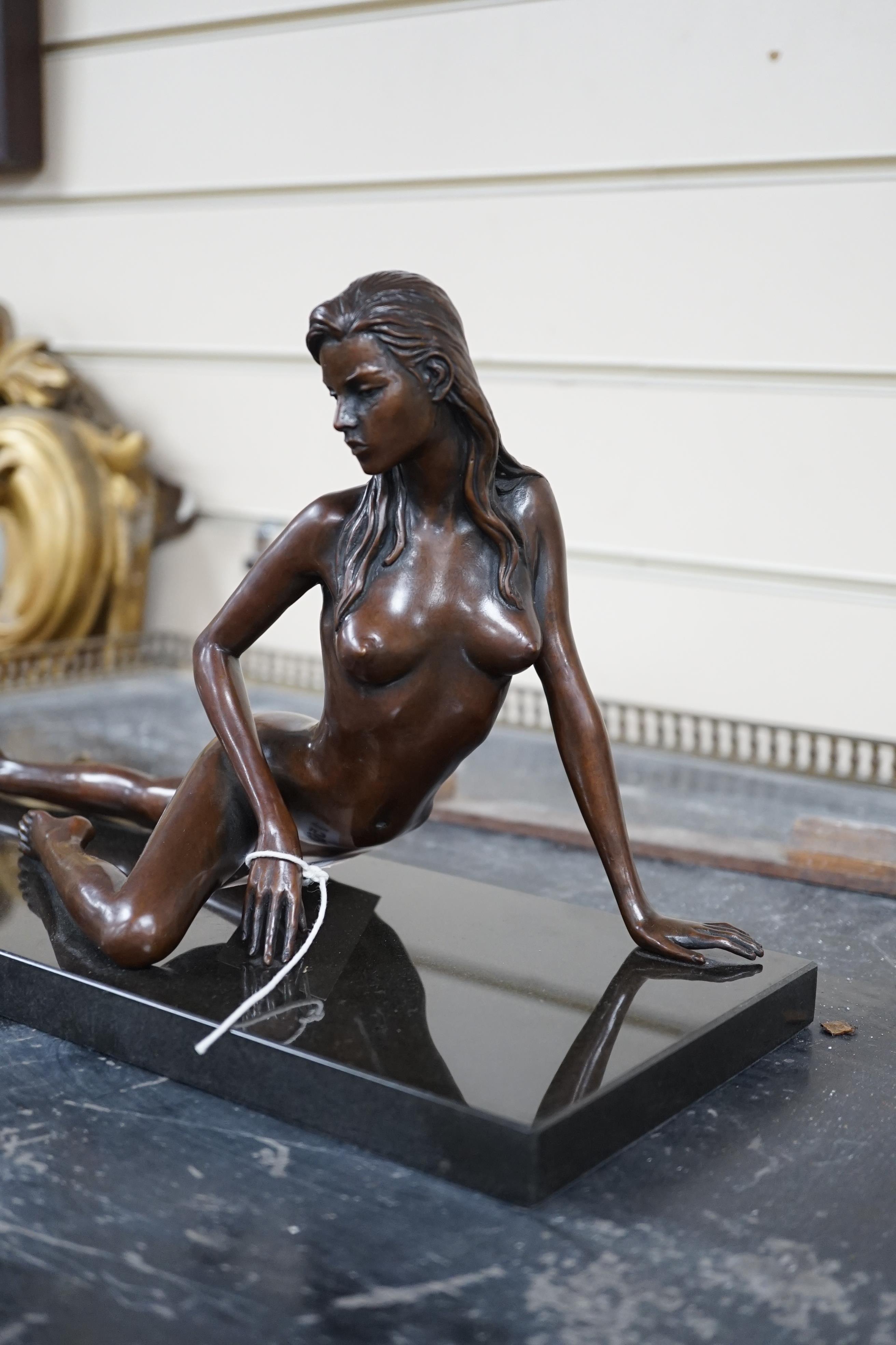 Jonathan Wylder (born 1957). A bronze reclining nude 'Prague', one of edition of eight, 38cm wide, 21cm high